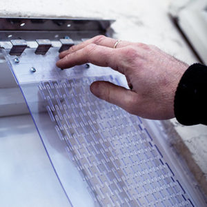 Fitting a PVC strip curtain onto a metal hanging strip